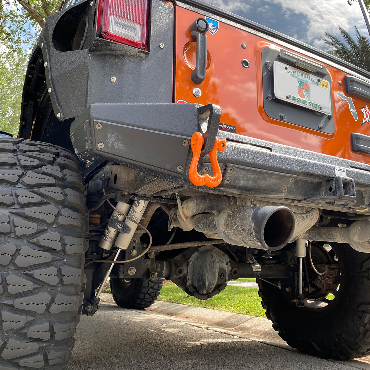 Obscene Orange Shackle on the rear shackle mount of a Jeep Wrangler JK customer rear bumper